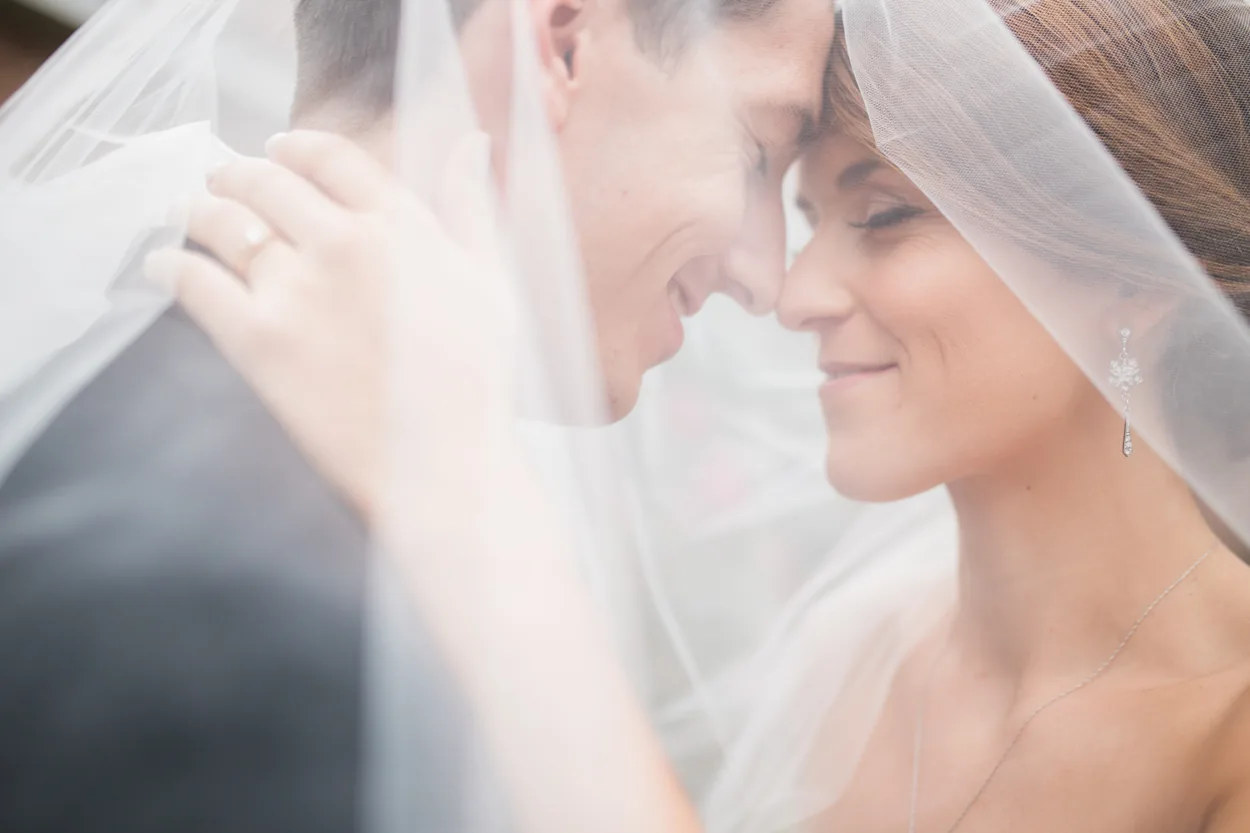 Wedding couple through a veil