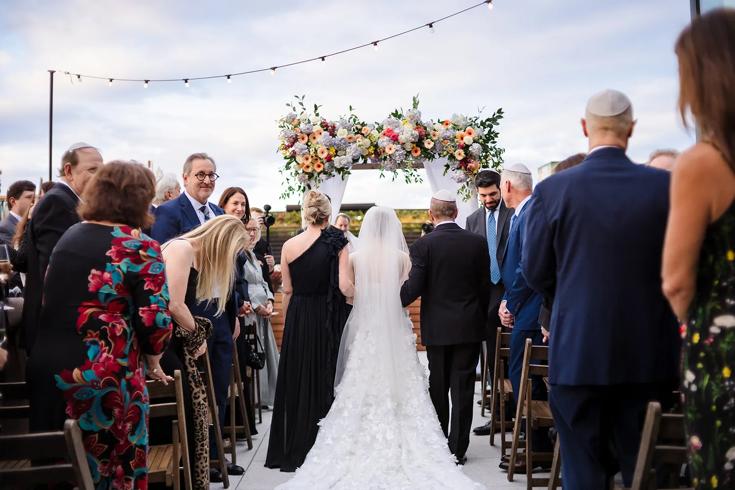 Outdoor wedding ceremony from behind the aisle