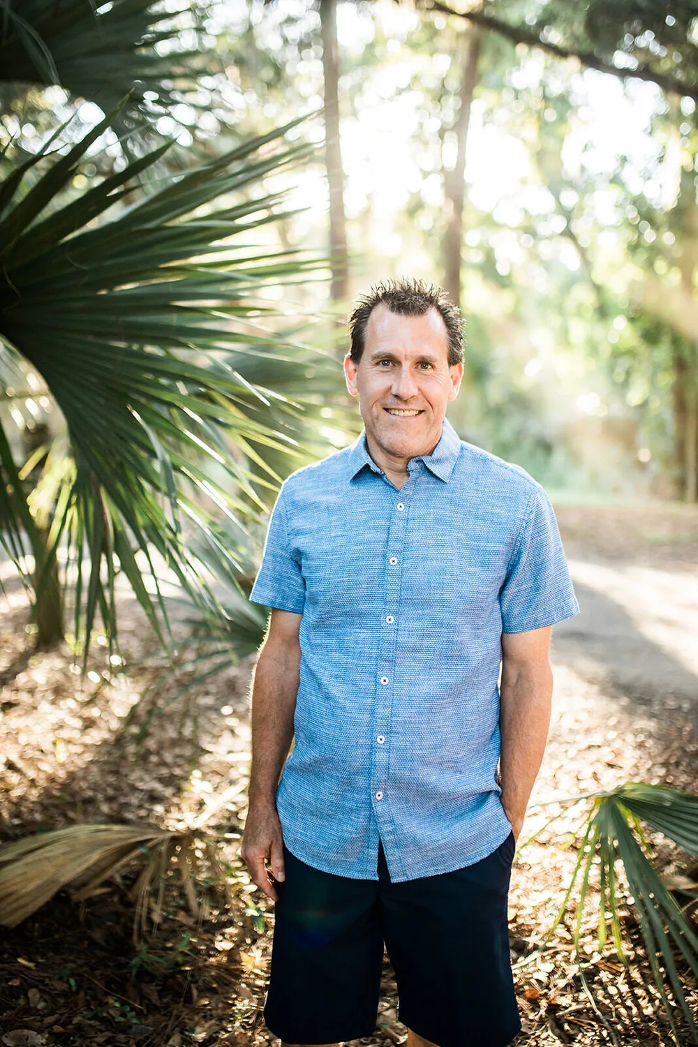 Outdoor portrait of a man in blue shirt