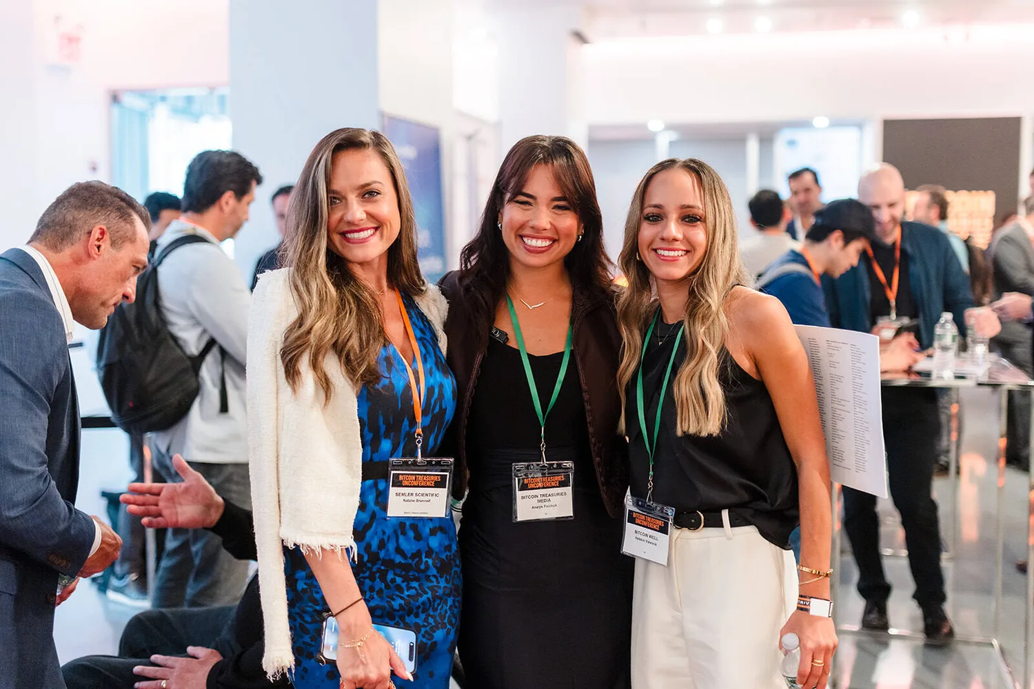 Corporate event guests smiling at a conference